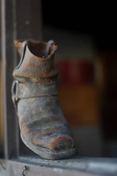 istock Old dusty vintage boot at abandoned building 992954934