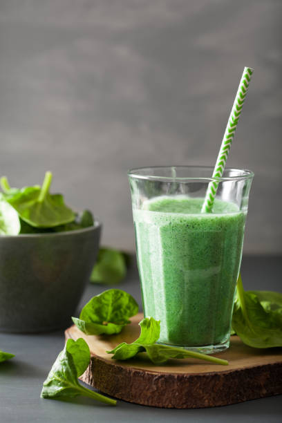 istock green spinach smoothie with spirulina, chia seed, lime, apple 992955794