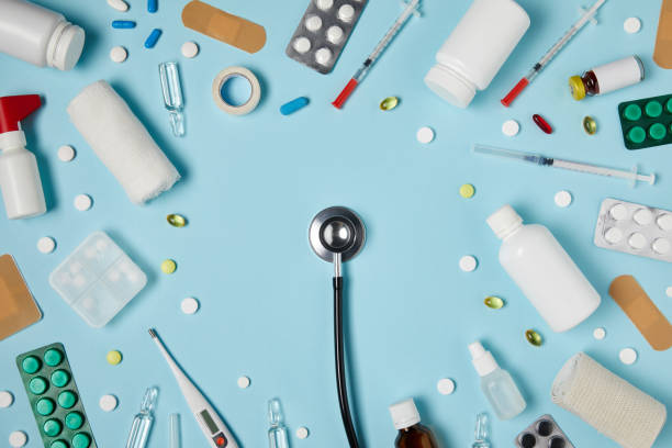 istock top view of stethoscope surrounded with various medicines on blue surface 992959556