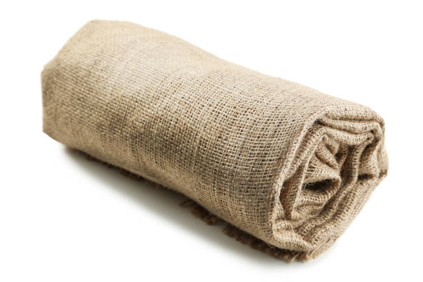 Rolled up sackcloth isolated on white background stock photo