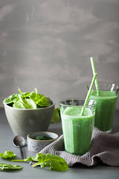 istock green spinach smoothie with spirulina, chia seed, lime, apple 992959678