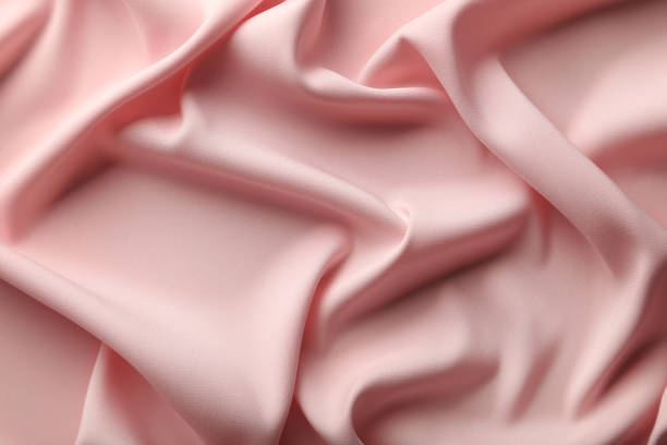istock Background of pink satin fabric 992959710