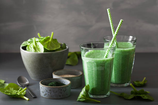 istock green spinach smoothie with spirulina, chia seed, lime, apple 992960044
