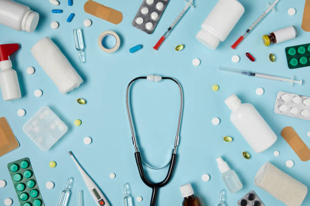 istock top view of stethoscope surrounded with different medicines on blue surface 992960260