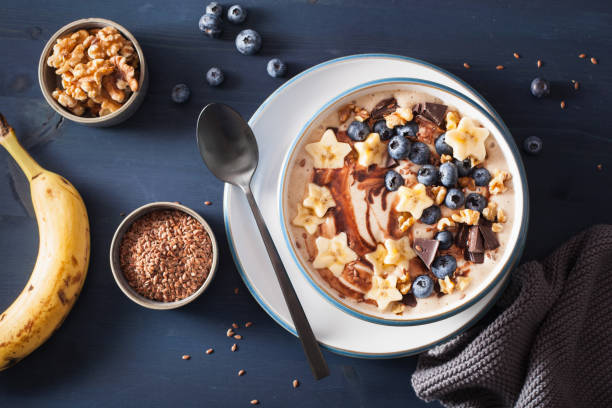istock healthy banana smoothie bowl with blueberry chocolate walnuts 992975574
