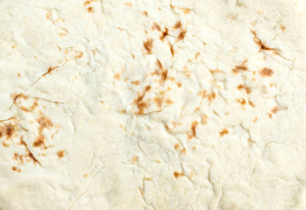 istock The texture of baked thin flatbread. Top view. 992976316