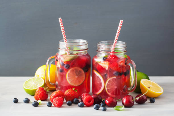 istock summer berry lemonade with lime and mint in mason jar 992980642