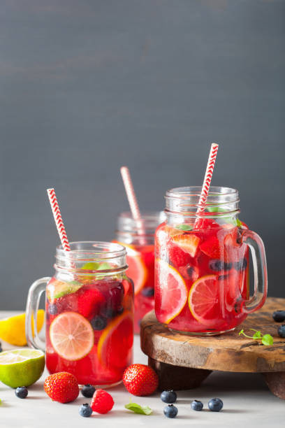 istock summer berry lemonade with lime and mint in mason jar 992981466