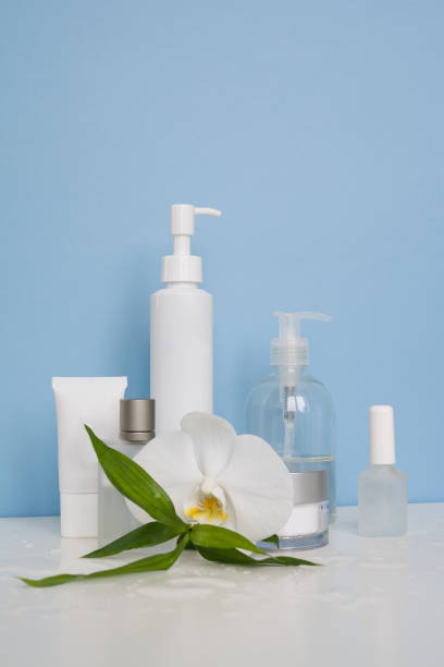 istock White cosmetic bottles on a blue background 992992246