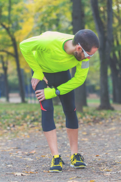 istock Exercising / jogging injury during workout in the park. 992998974