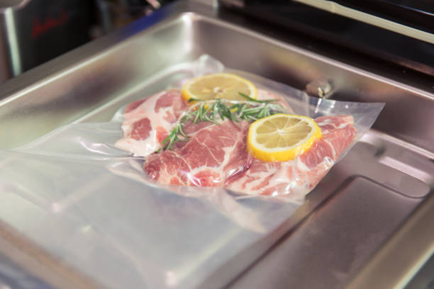 istock Sous vide steak with rosemary and lemons in vacuumed package. 993014914