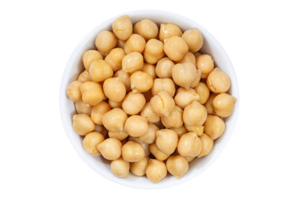 istock Chickpeas peas vegetable vegetables from above bowl isolated on white 993015862