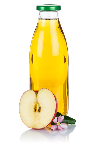 Apple juice in a bottle apples fruit fresh fruits portrait format isolated on a white background