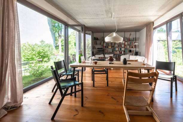 Residential area with ecological and sustainable green residential buildings, low-energy houses with wooden facade, timber construction and green courtyard