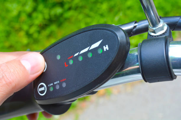 istock Turning on electric bike, E-bike or bicycle. Pressing a button on control board or controller to choose speed and power level. Unfiltered, with natural lighting 993025410