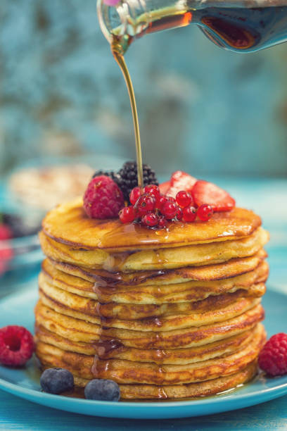 istock Homemade Pancakes with Berries and Maple Syrup 993026026