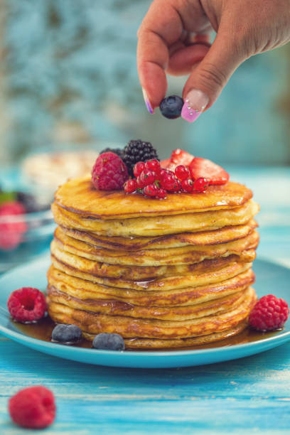 istock Homemade Pancakes with Berries and Maple Syrup 993026154