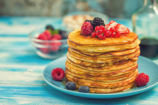 istock Homemade Pancakes with Berries and Maple Syrup 993037500