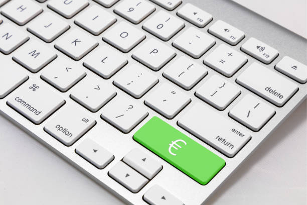 White Mac style keyboard with green € \