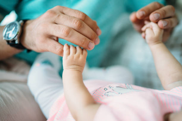 istock Baby Holding Fathers Hand 993067784