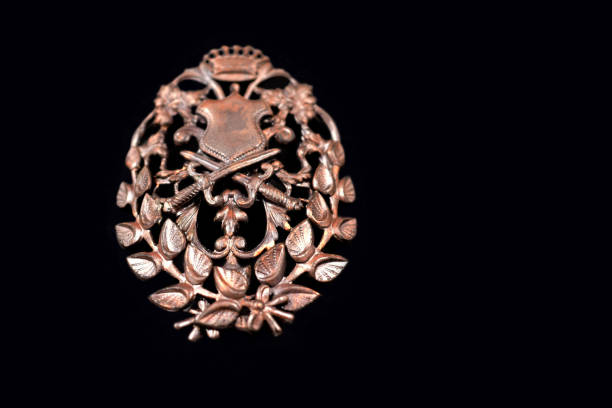Crest on a black background. Ornate brooch photo images