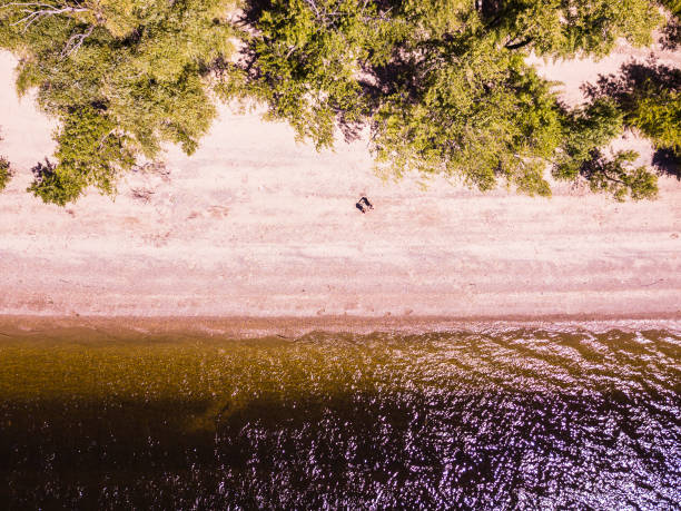 istock top down two man chill on summer tropical beach aerial view 993068892