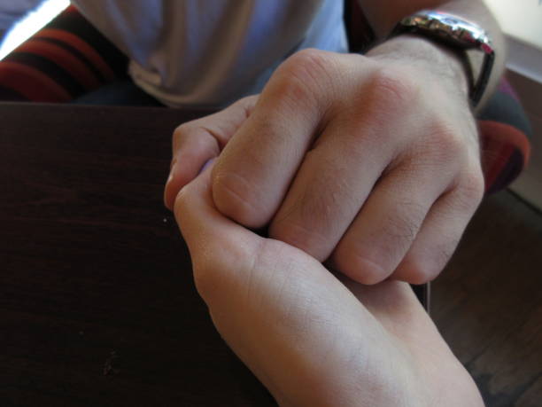 istock Couple holding hands in a restaurant 993074016