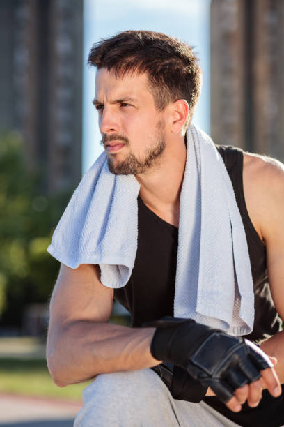 istock Tired young man resting after a hard workout 993074046