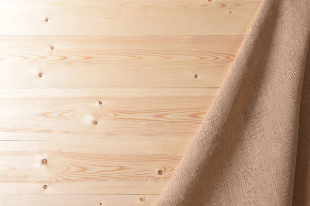 istock Rustic background with wooden wall and sackcloth 993080934