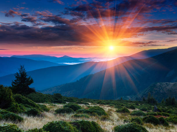 istock Panoramic view of colorful sunrise in mountains. 993084904