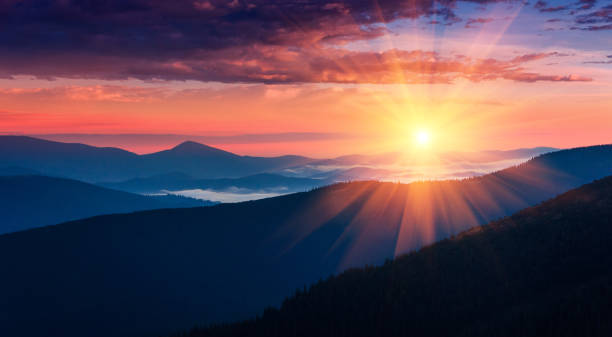 Panoramic view of colorful sunrise in mountains. stock photo