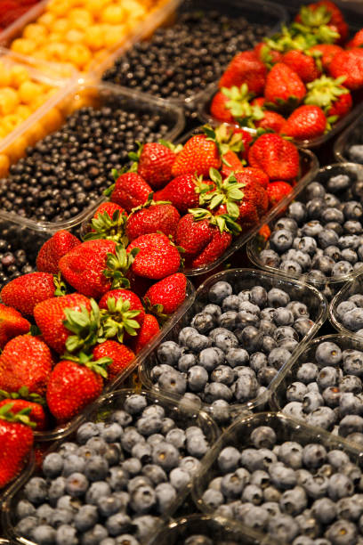 istock Colourful mix of different fresh berries at market 993085918