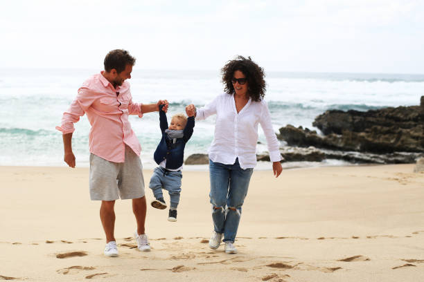 istock Young family on the beach 993089852