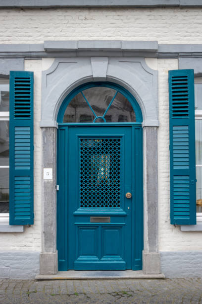 istock Blue door with shutters in Bruges 993090640