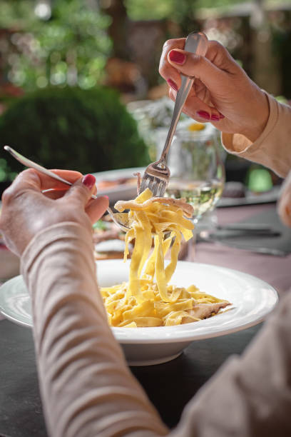 istock Pasta with calamari, Carbonara pasta, spaghetti with pancetta, seafood. Calamari spaghetti on white plate. Mediterranean pasta. seafood. Italian food. 993093832