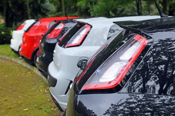 Details of Fiat Punto cars Smoszewo, Poland - 2nd September, 2017: Details of Fiat Punto cars parked on the grass during the public meeting of Italian car friends. These cars are one of the most popular city cars in Europe. punto stock pictures, royalty-free photos & images