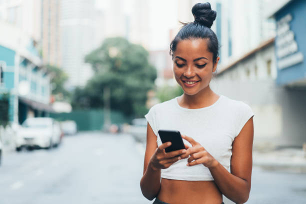 istock Beautiful woman using phone 993097978