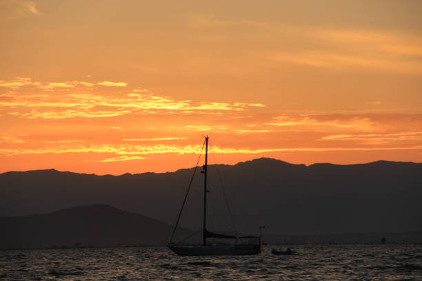 istock BOAT AT SEA WITH SUNSET 993114634