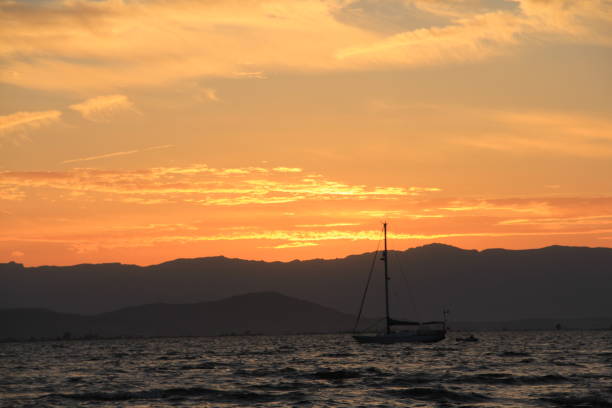 istock BOAT AT SEA WITH SUNSET 993114658