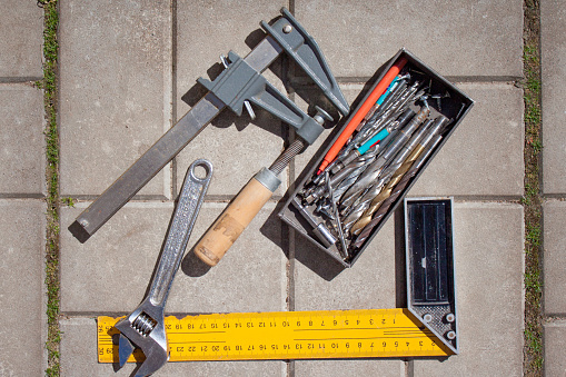 set of tools and working instruments on stone background