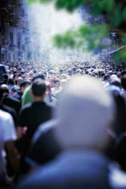 istock people walking on crowded busy city street 993130112