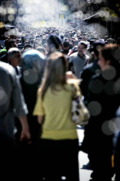 istock people walking on crowded busy city street 993130502
