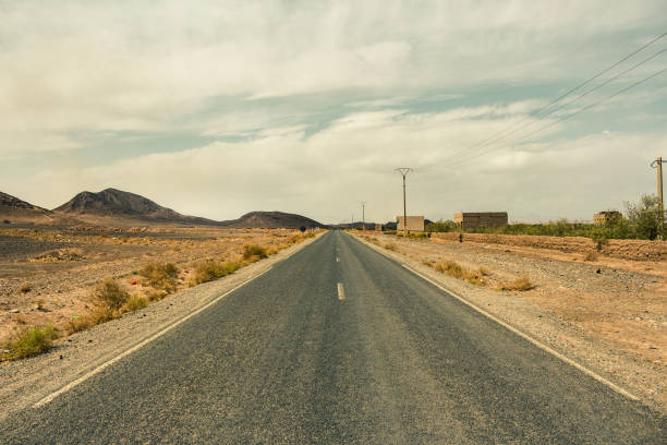 istock Empty Desert Road in Sahara Morocco 993135140