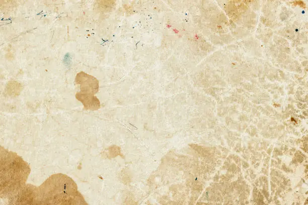 Texture of old moldy paper with dirt stains, spots, inclusions cellulose, brown cardboard texture background, grunge vintage backdrop