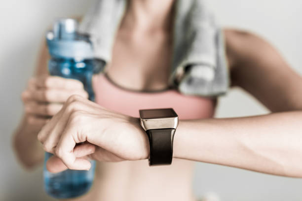 istock Woman checking her heart beat on smart watch 993185826