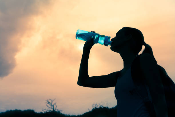 istock Woman drinking water 993185860