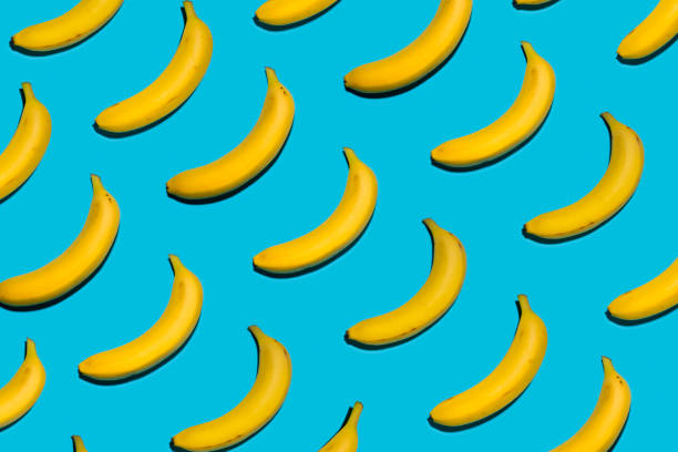 istock Yellow Bananas on Symmetrical Blue Background 993194518