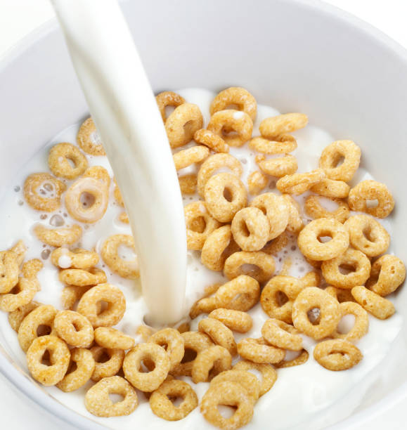 istock Cereal Bowl With Milk Pouring 993197804