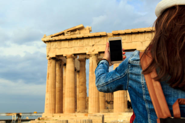 Girl taking photos of Acropolis, Athens, Greece Young girl traveler taking photos of Acropolis, Athens, Greece yacht selfie stock pictures, royalty-free photos & images