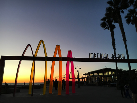 Beach pier entrance at sunset